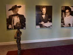 Three black and white photos of Swedish Politicians on a wall