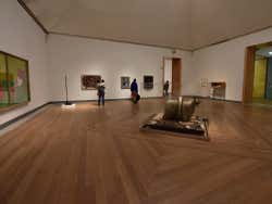 A room in an art museum with works of art