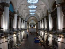 A large room with high ceilings in the a museum