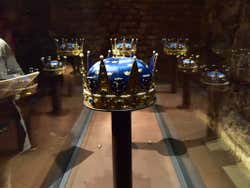 Blue and gold crowns in a display in the Royal Palace Treasury